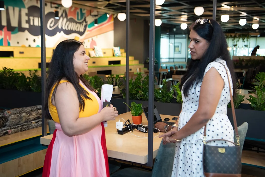 Two attendees talking during the LFTG Bengaluru networking session